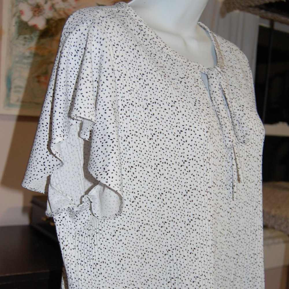 Tiny, dotted, peplum blouse